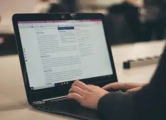 person typing on laptop computer