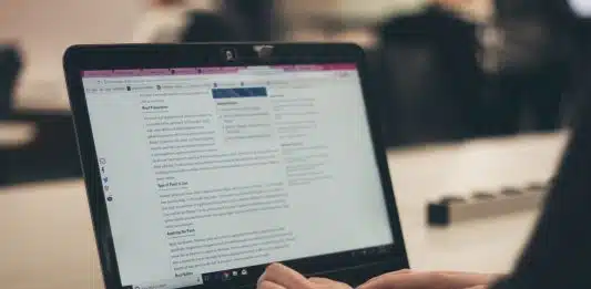 person typing on laptop computer